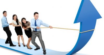 portrait of business team pulling up bar using rope. growth chart concept